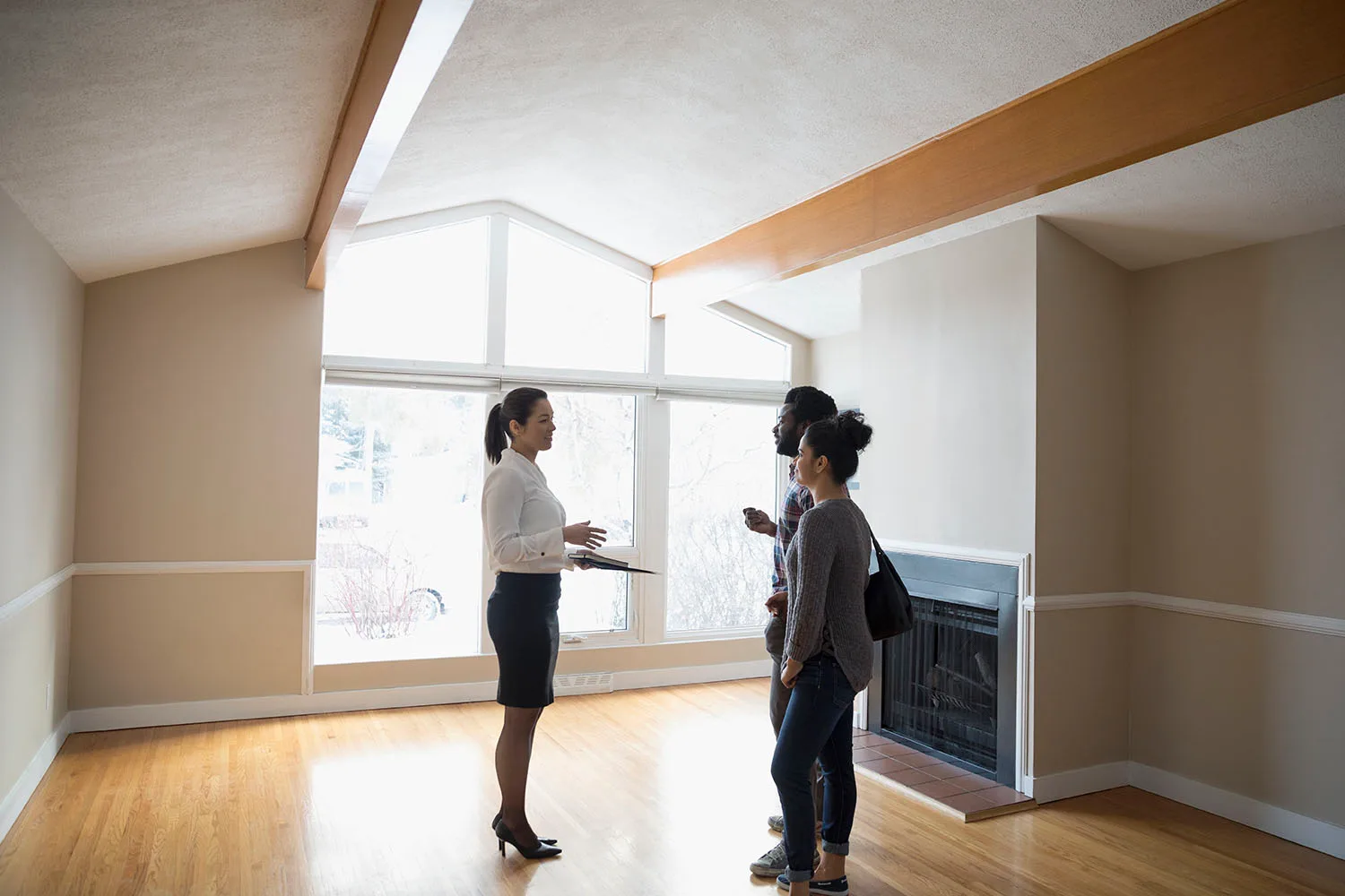 people standing in empty house