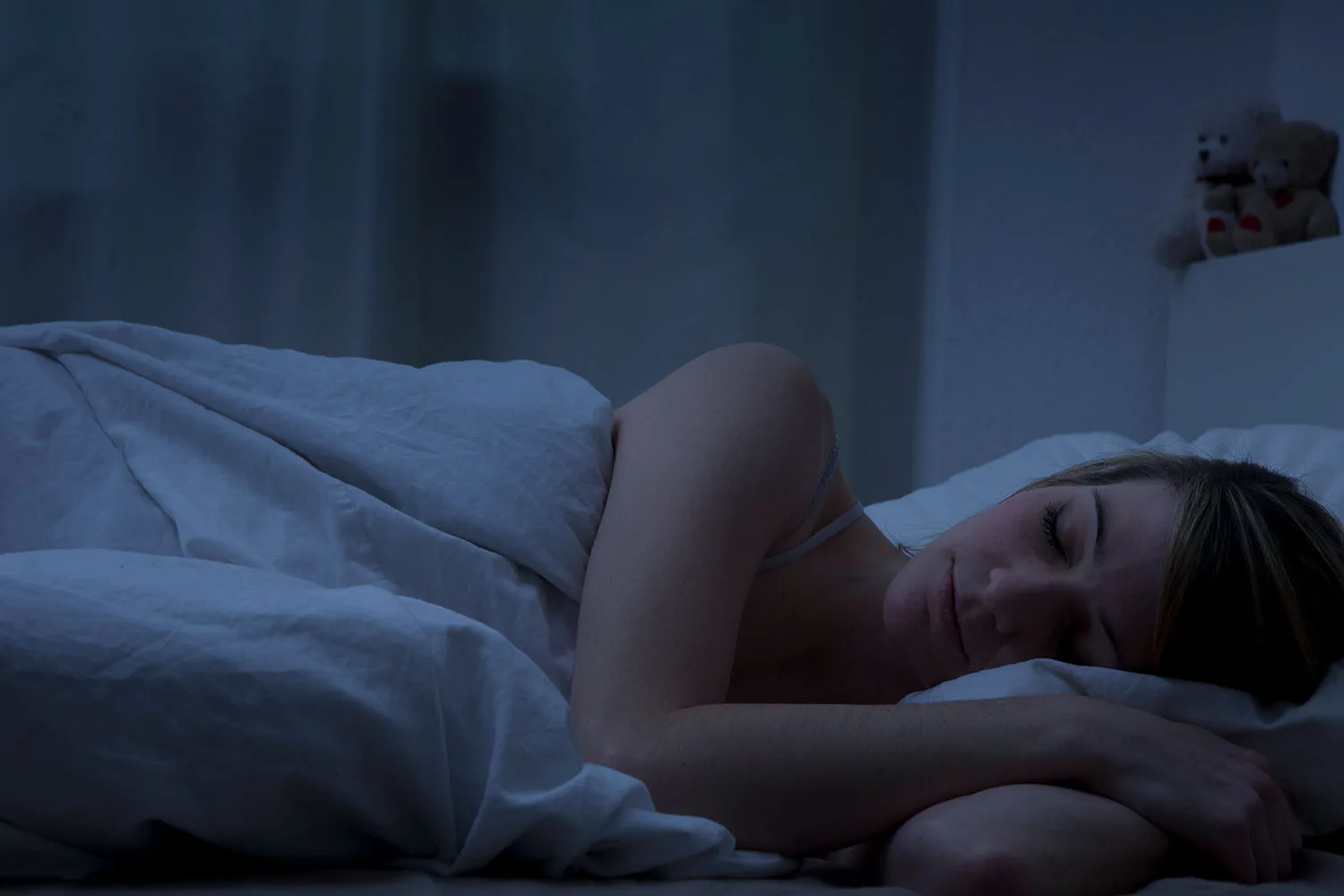 woman asleep in bed at night
