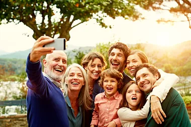 family taking selfie using phone