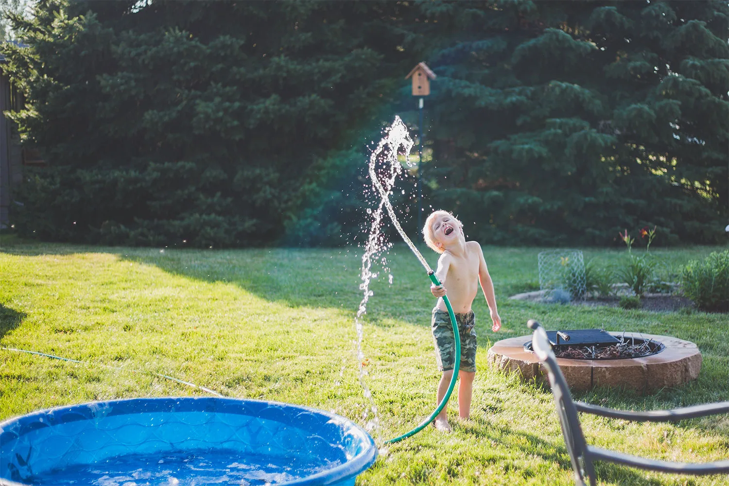 Boy playing outside on lawn