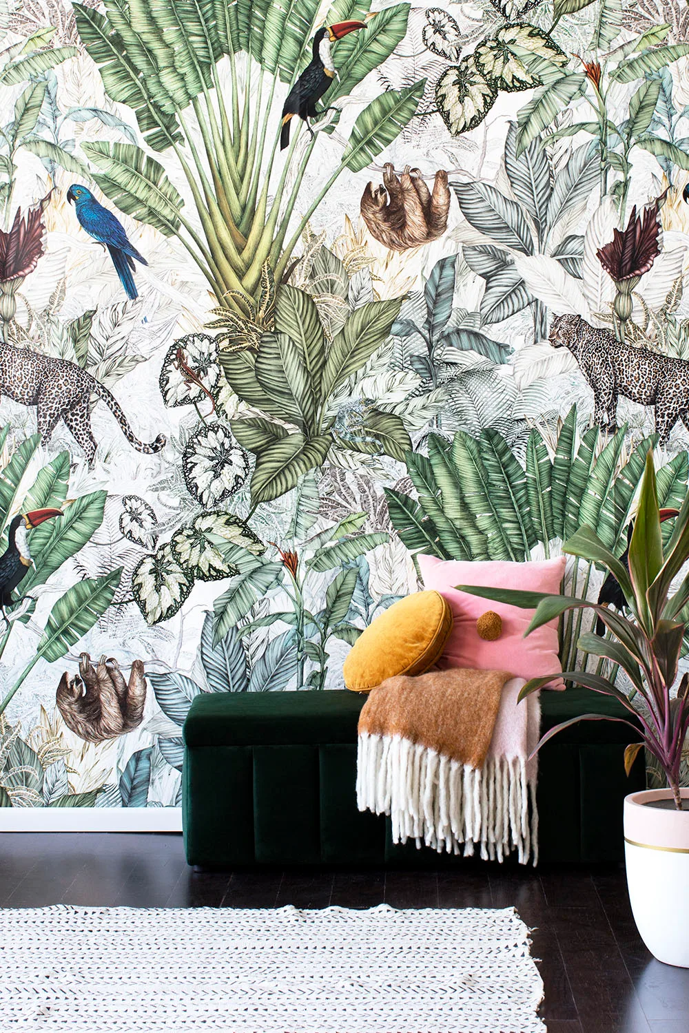 botanical print wallpaper and velvet ottoman