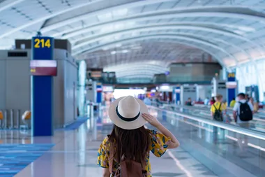 girl walking through airport