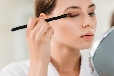 woman applying eyeshadow