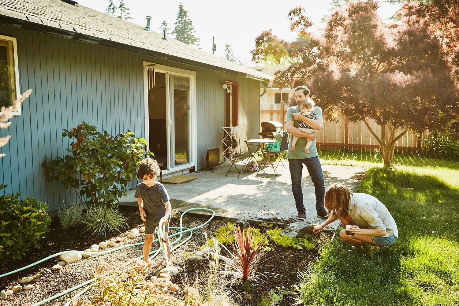 family gardening in backyard