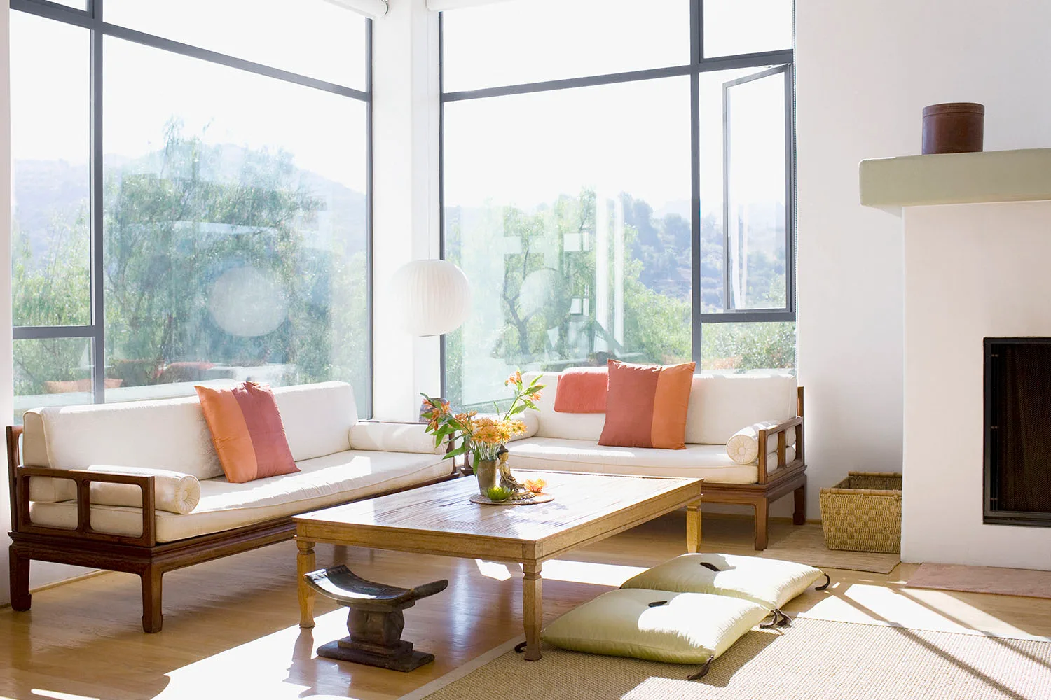 living room with pink cushions and timber accents