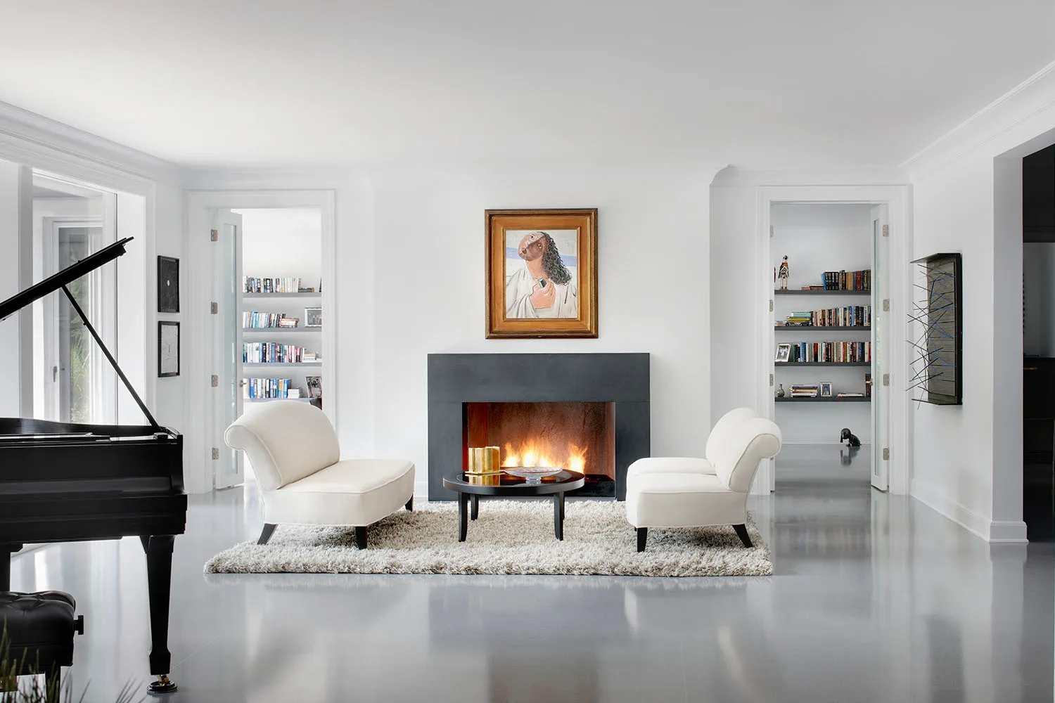 white living room with art above fire place
