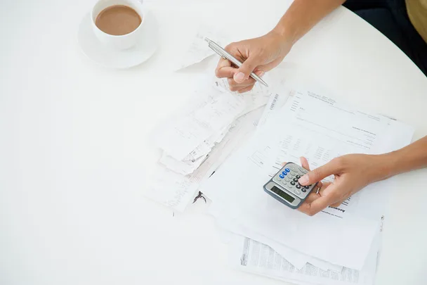 person going through reciepts