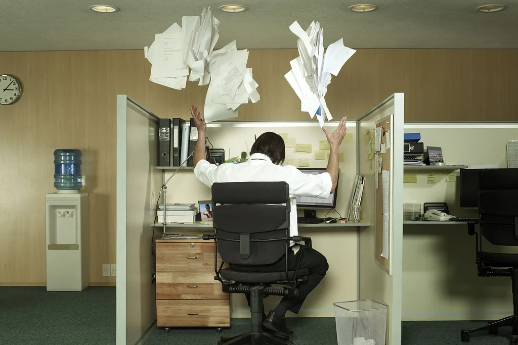 man throwing papers