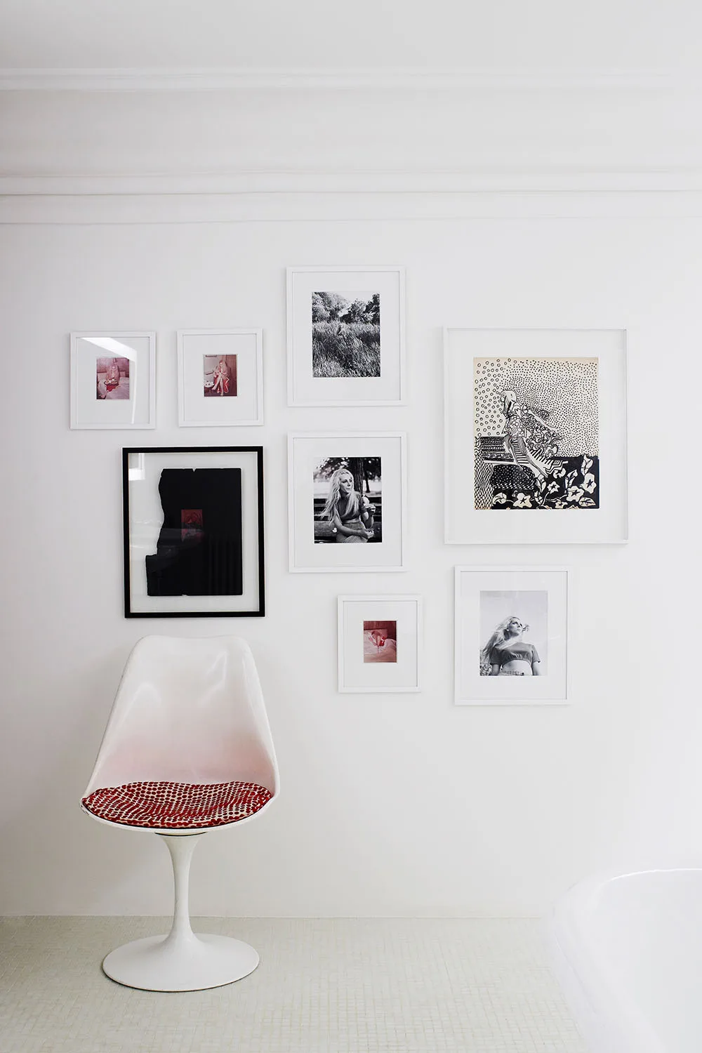 chair with gallery wall of images
