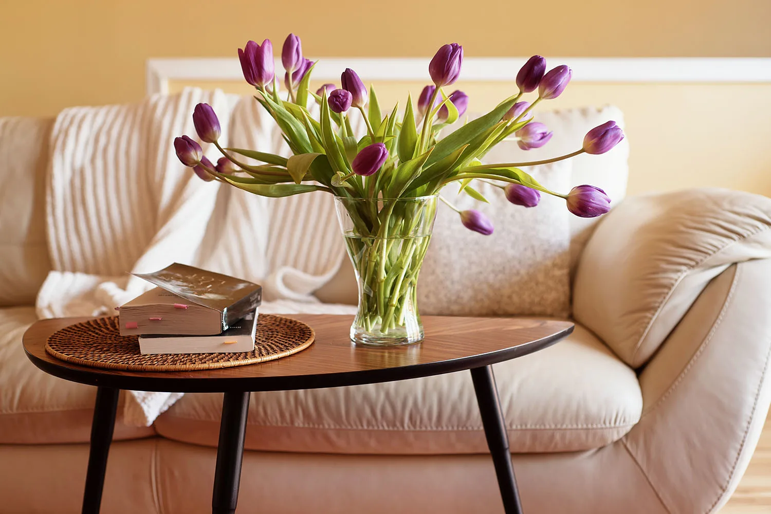 flowers on coffee table in front of sofa