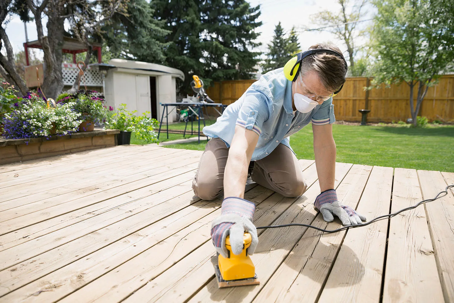 man sanding deck