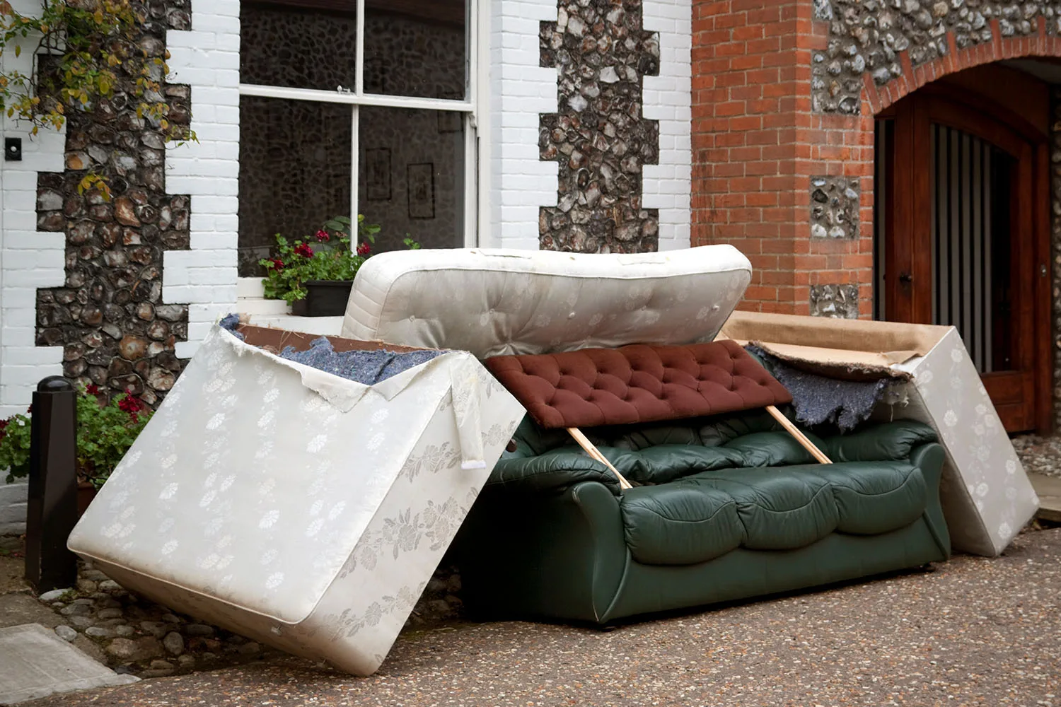 junk furniture out front of house