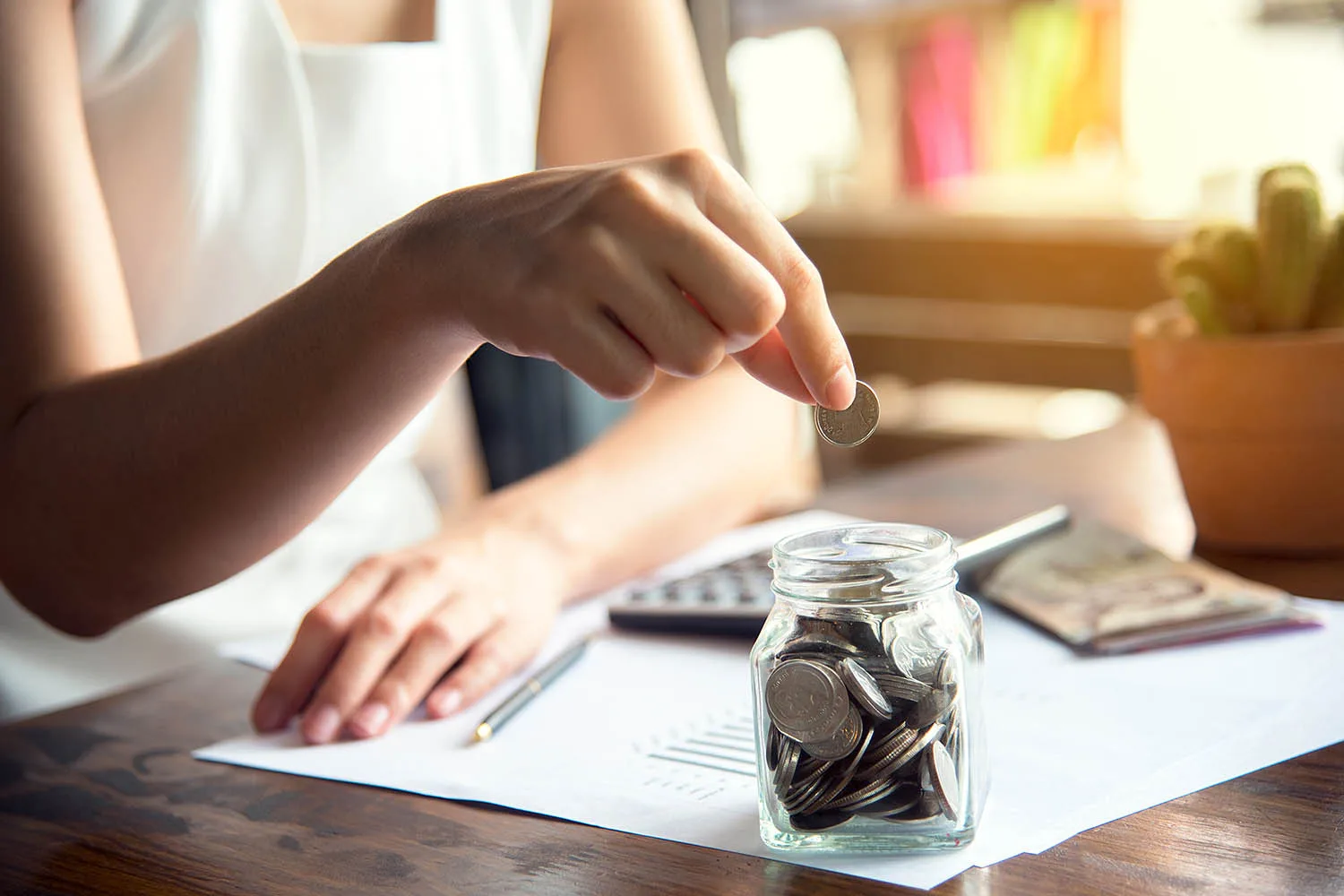 woman saving coins up