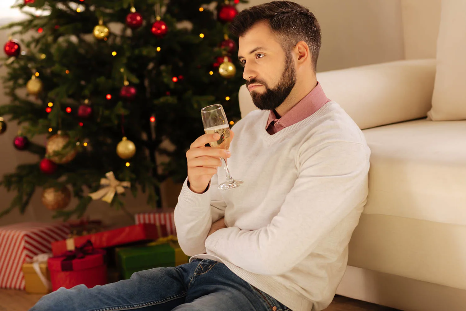 disappointed man drinking champagne