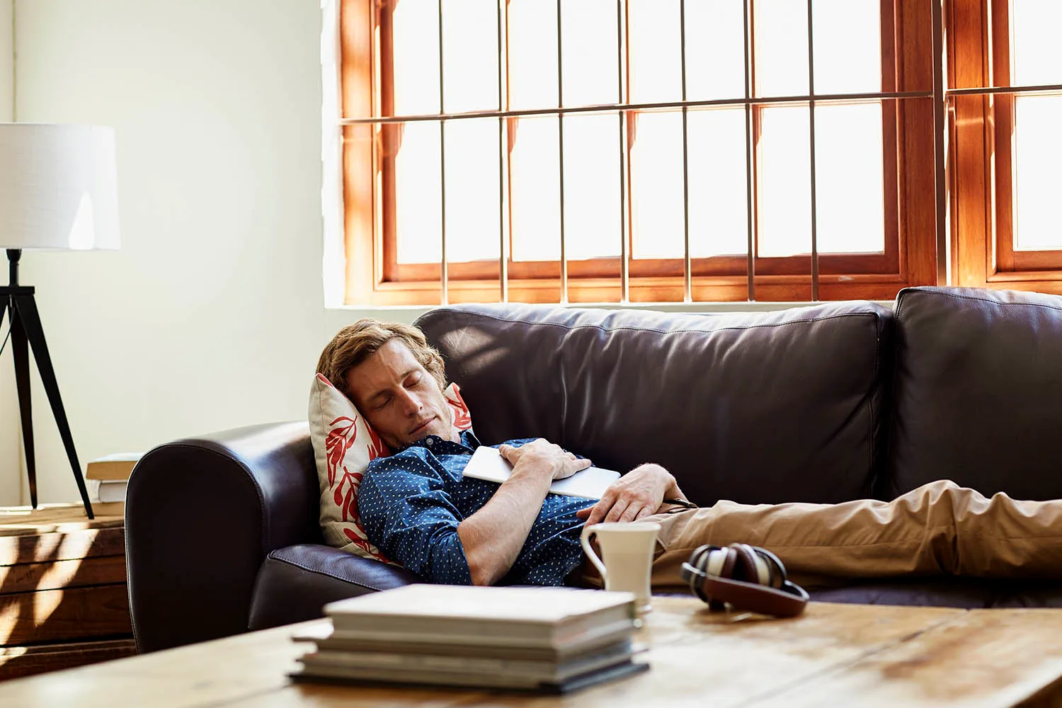 man sleeping on couch
