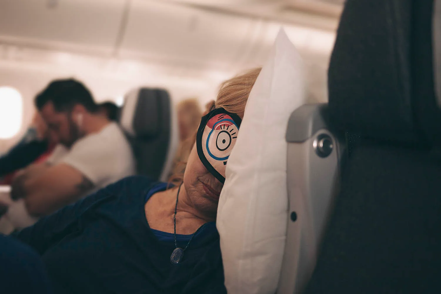 Woman sleeping on plane