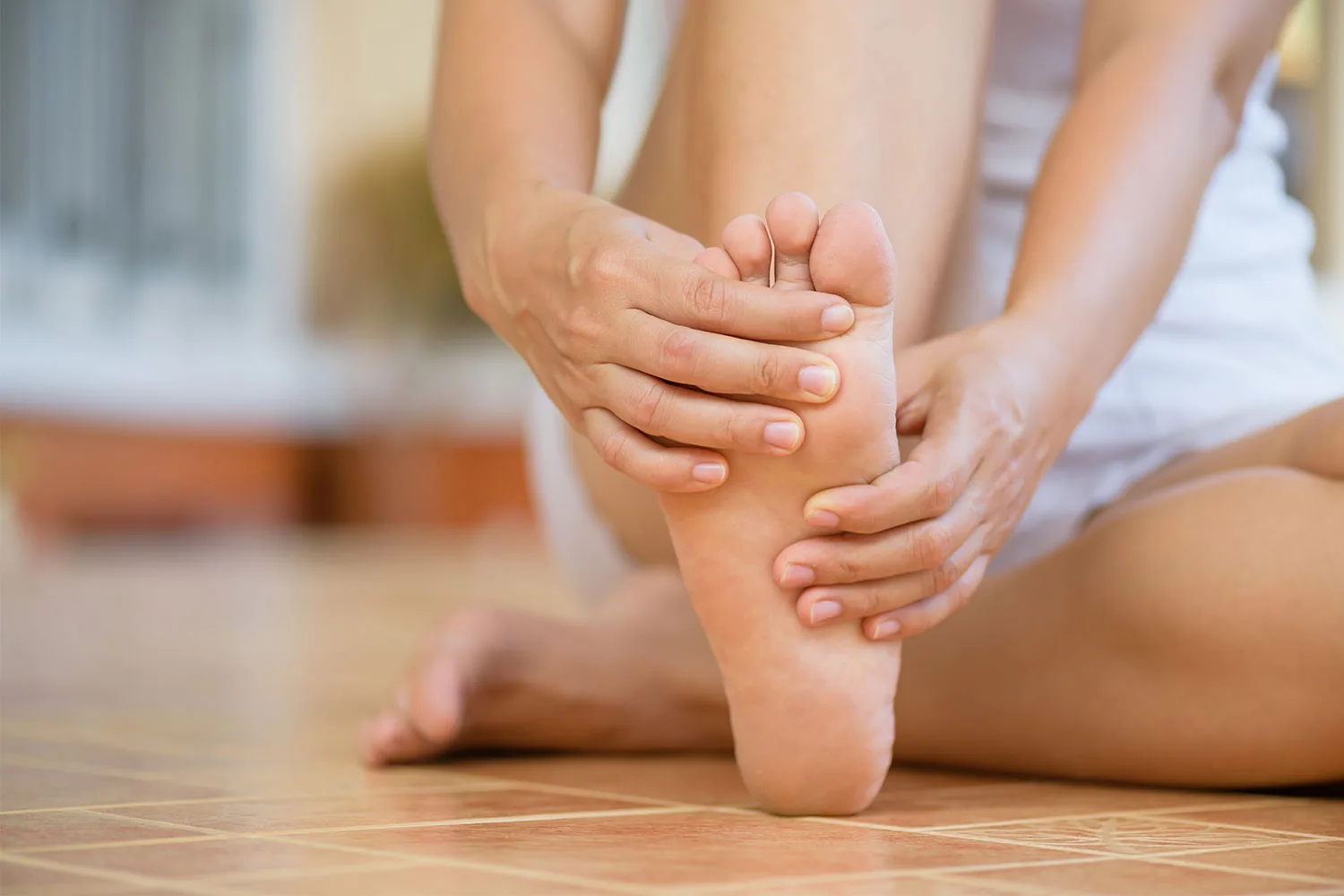 Woman massaging foot