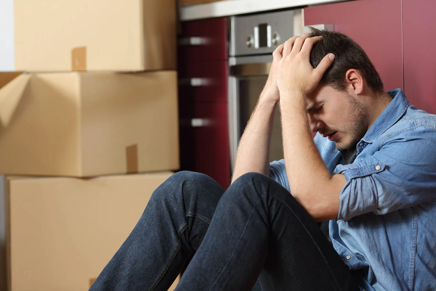stressed man sitting on floor