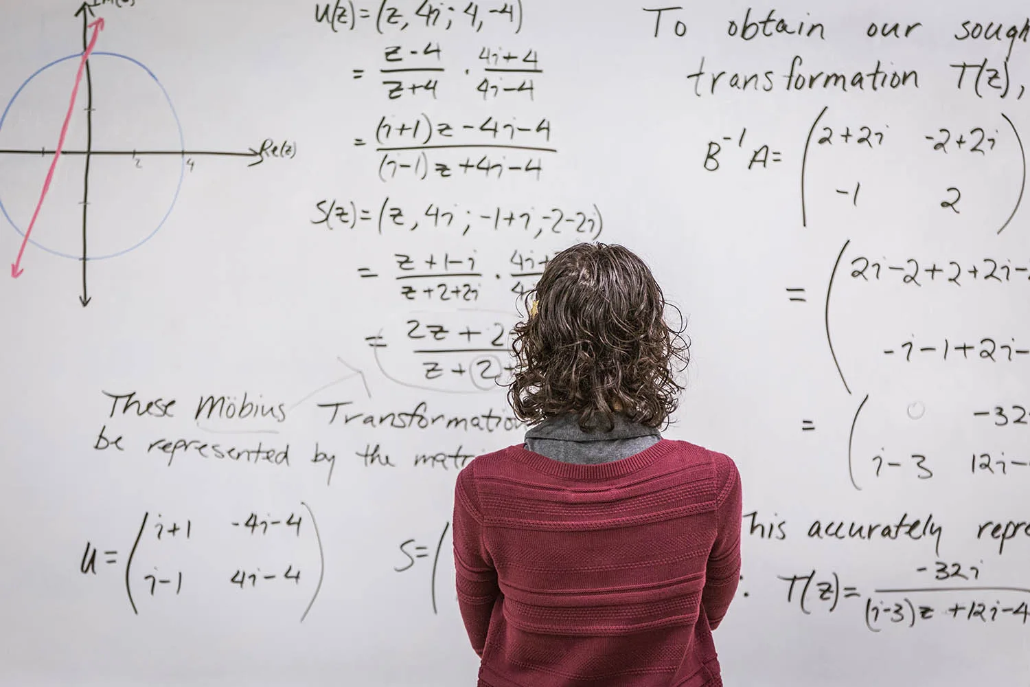 female mathematician staring at board