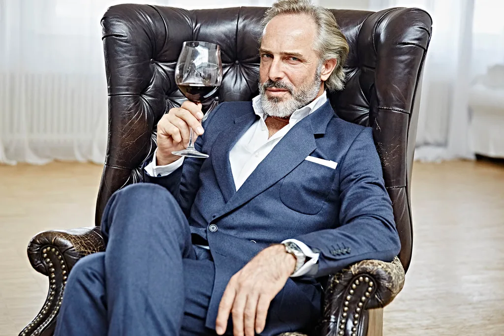 man holding wine glass
