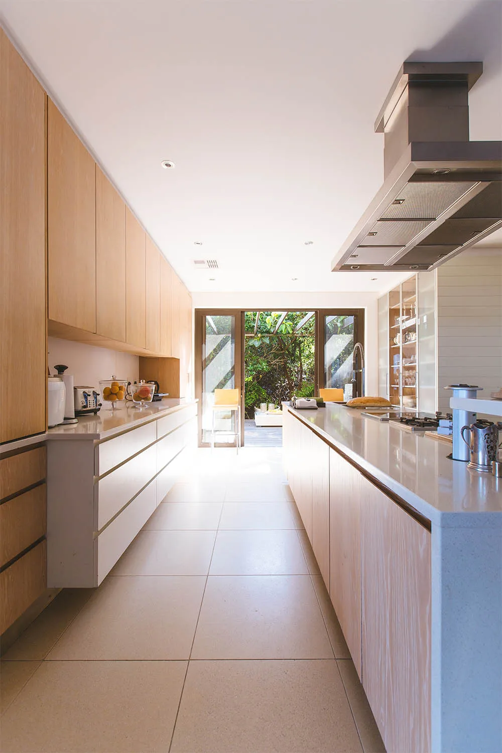 modern kitchen design idea with white cabinetry and blonde timber