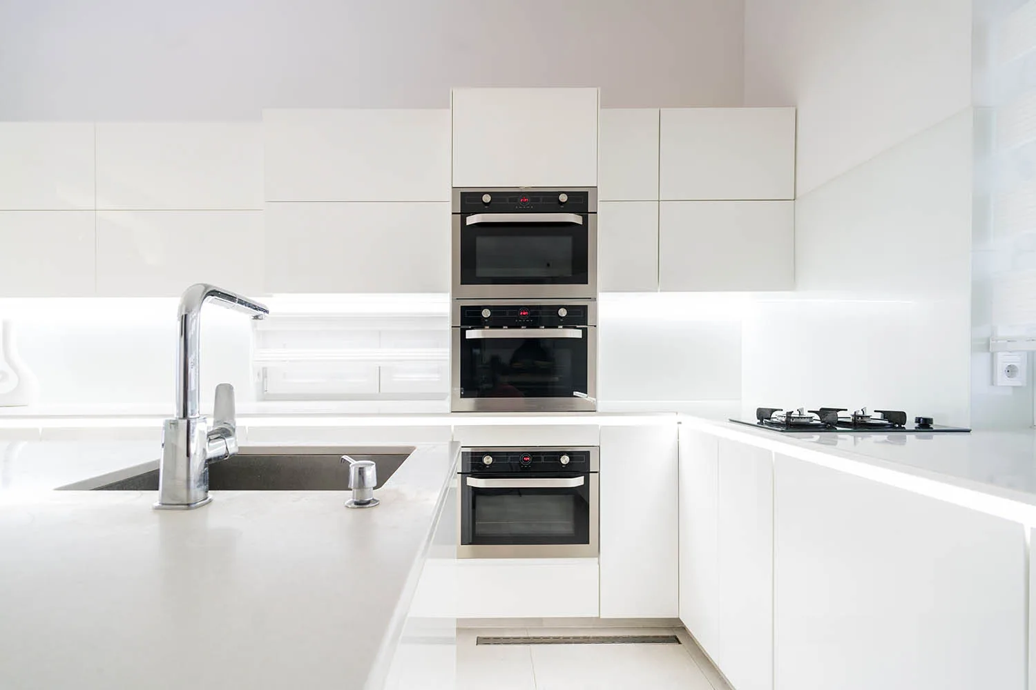 sleek and high-tech white kitchen