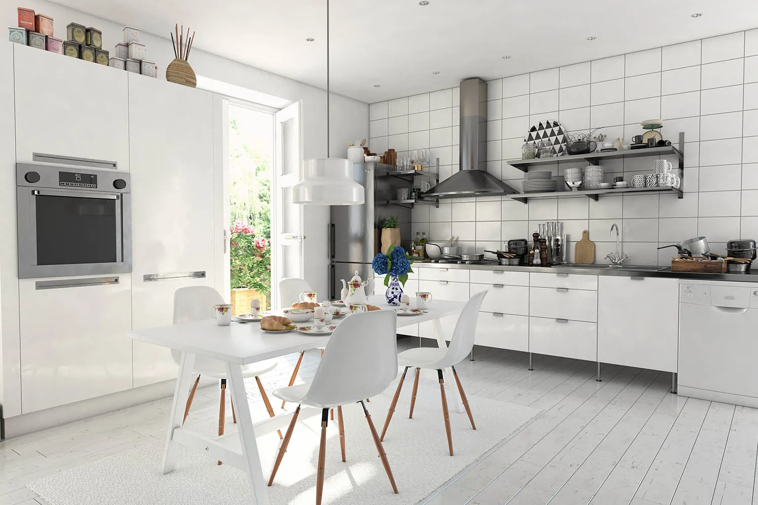 All white kitchen with white timber floors, tiled walls and stainless steel appliances.