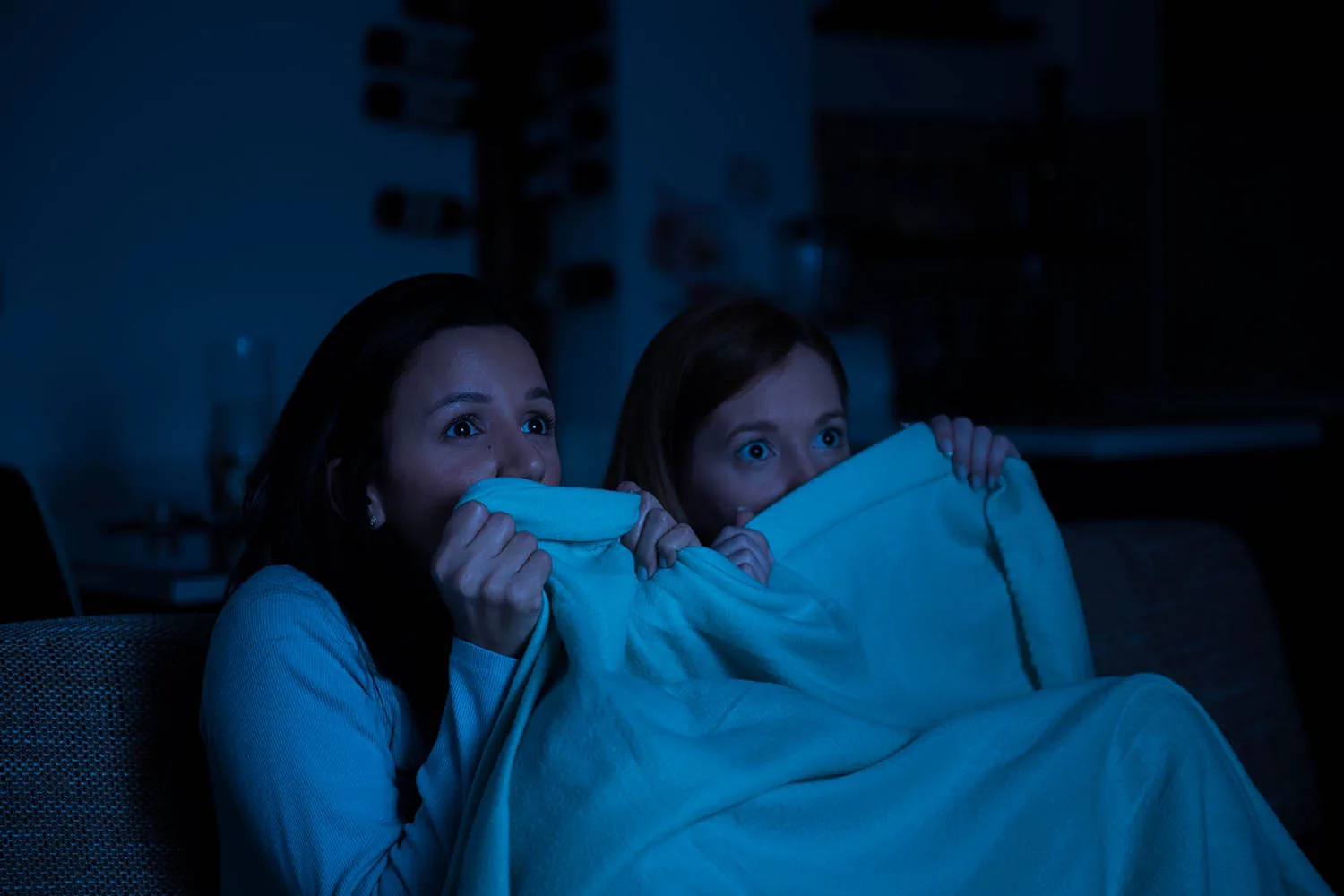 girls watching horror movie