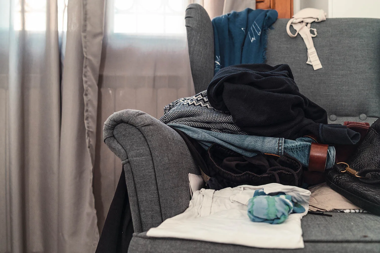 pile of laundry on chair