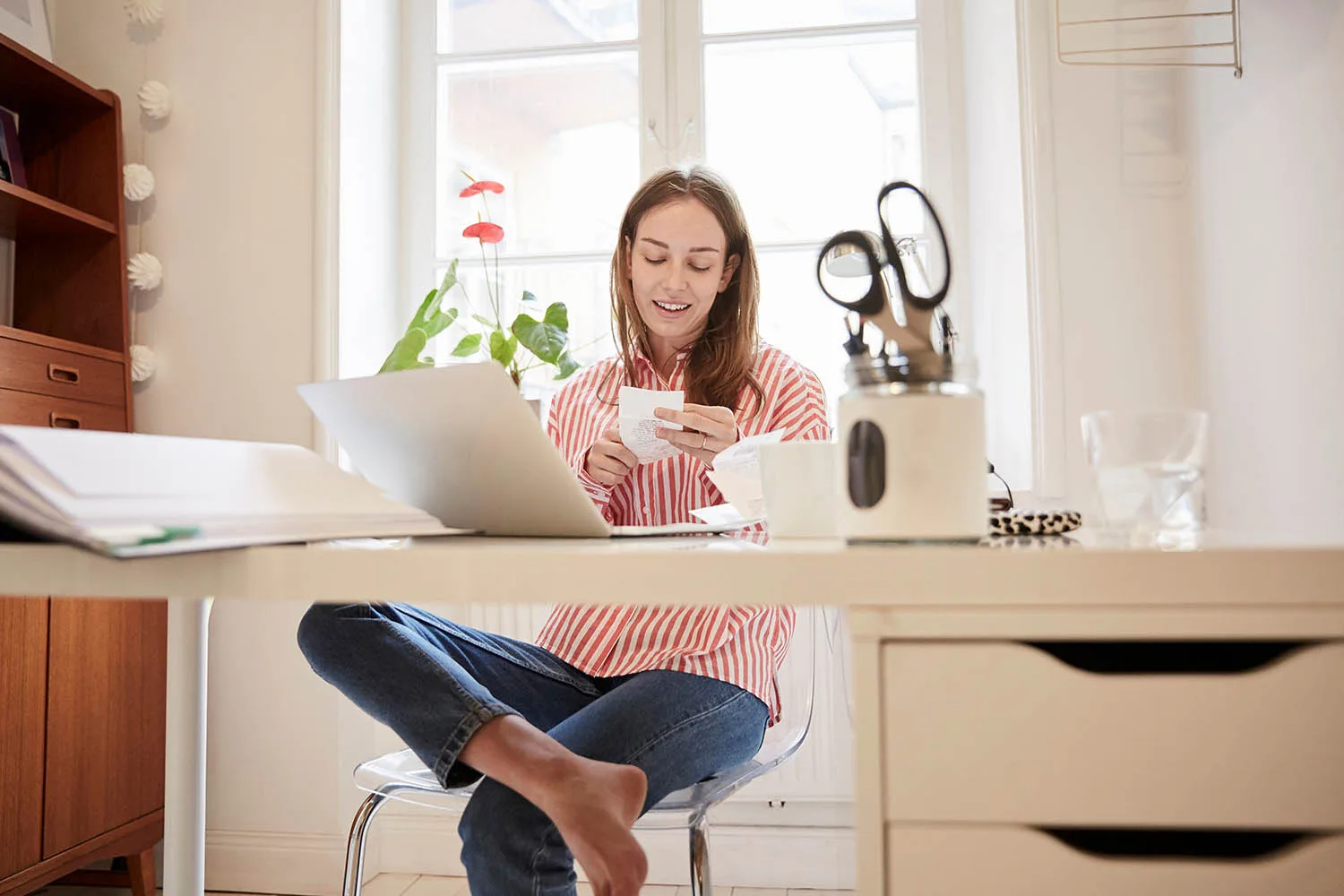 woman sitting at desk working on computer