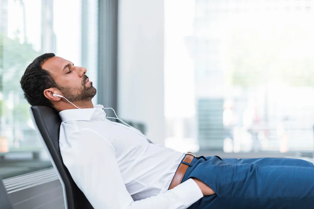 man sleeping in airport