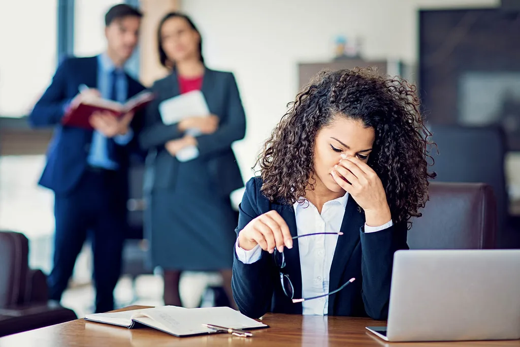 woman with headache at work