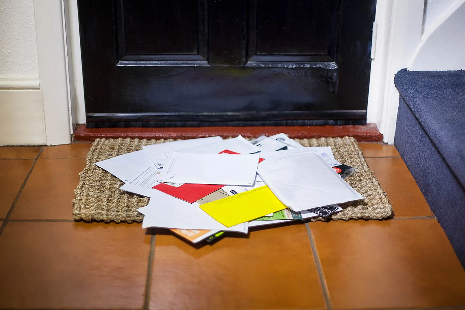pile of mail at front door