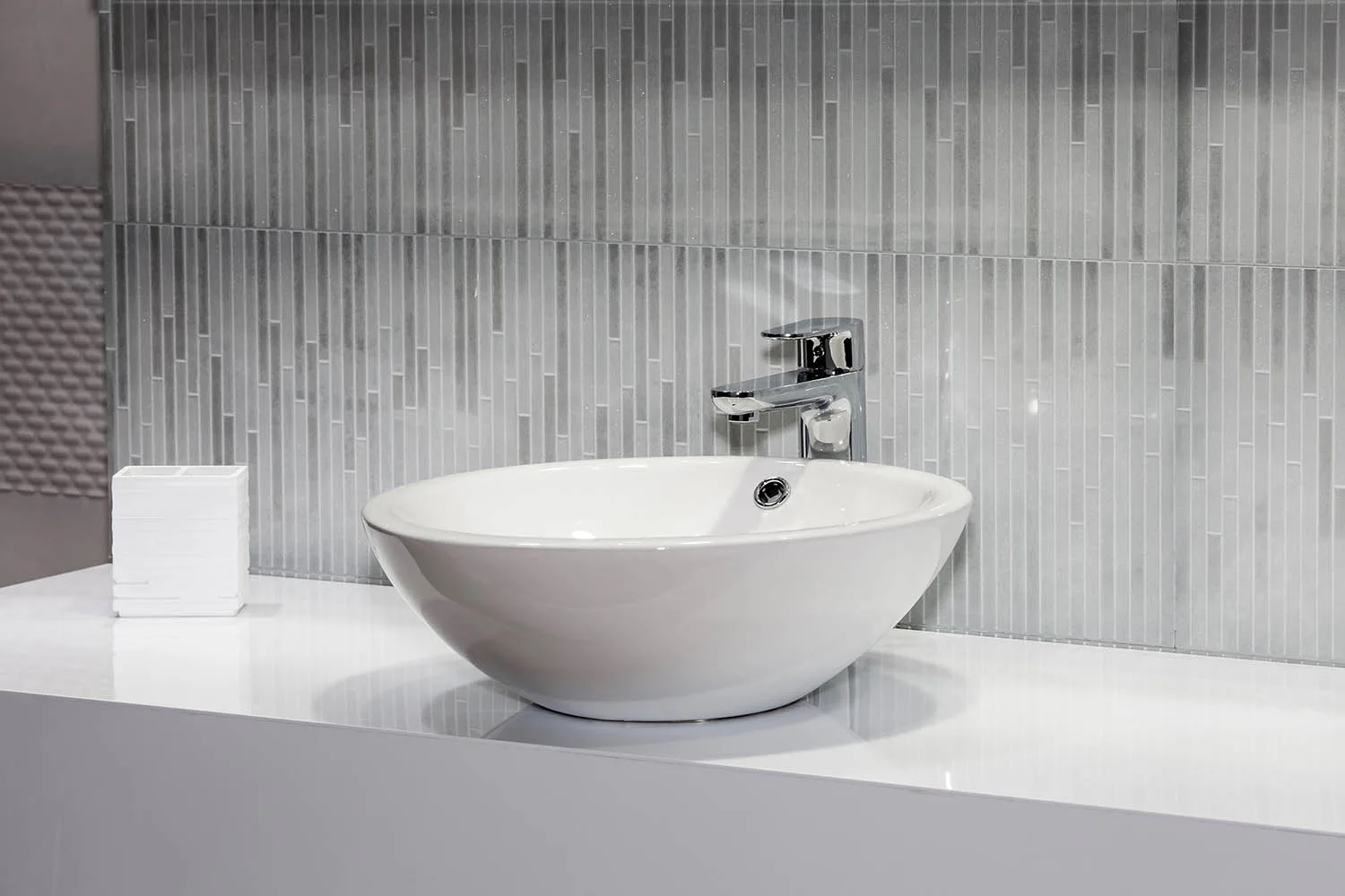 simple bathroom vanity with grey splashback