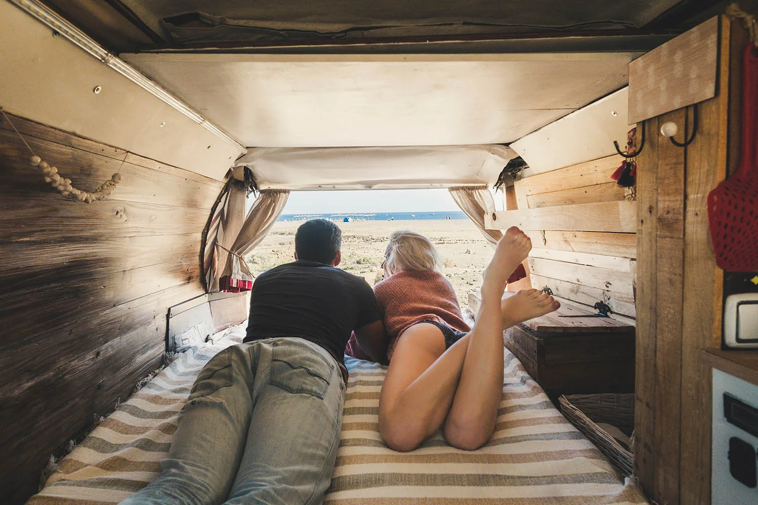 couple relaxing inside motorhome