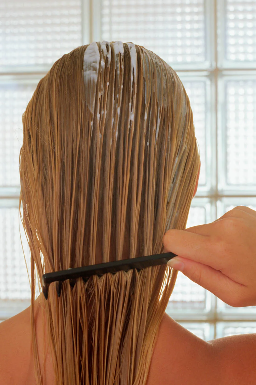 combing hair mask through hair