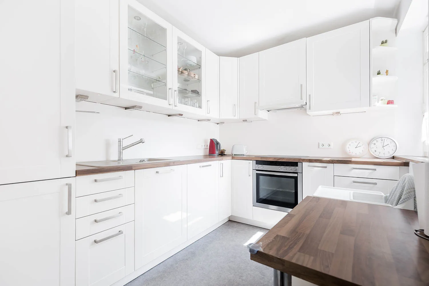 all white u shaped kitchen