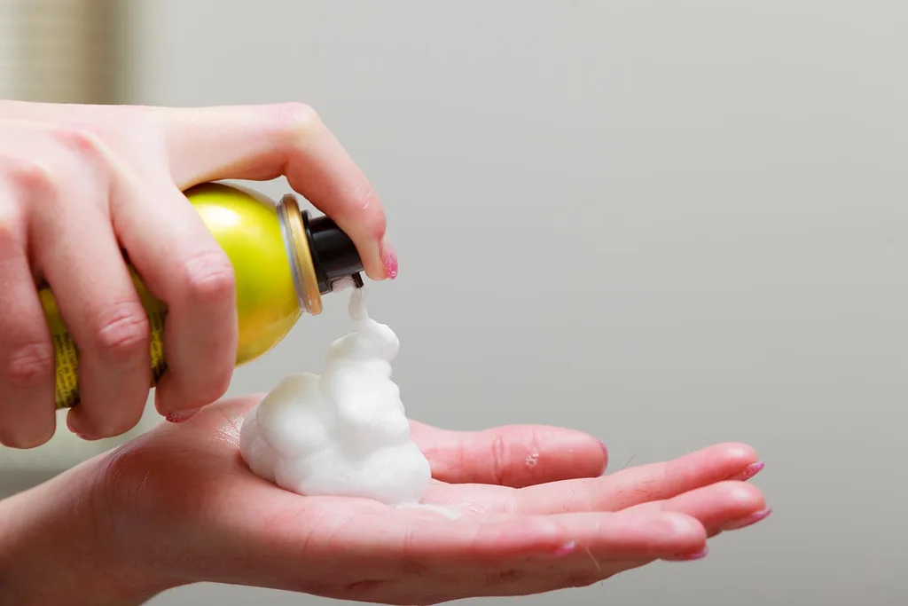 hair mousse in hand
