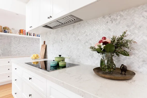 kitchen benchtop with flowers and pots