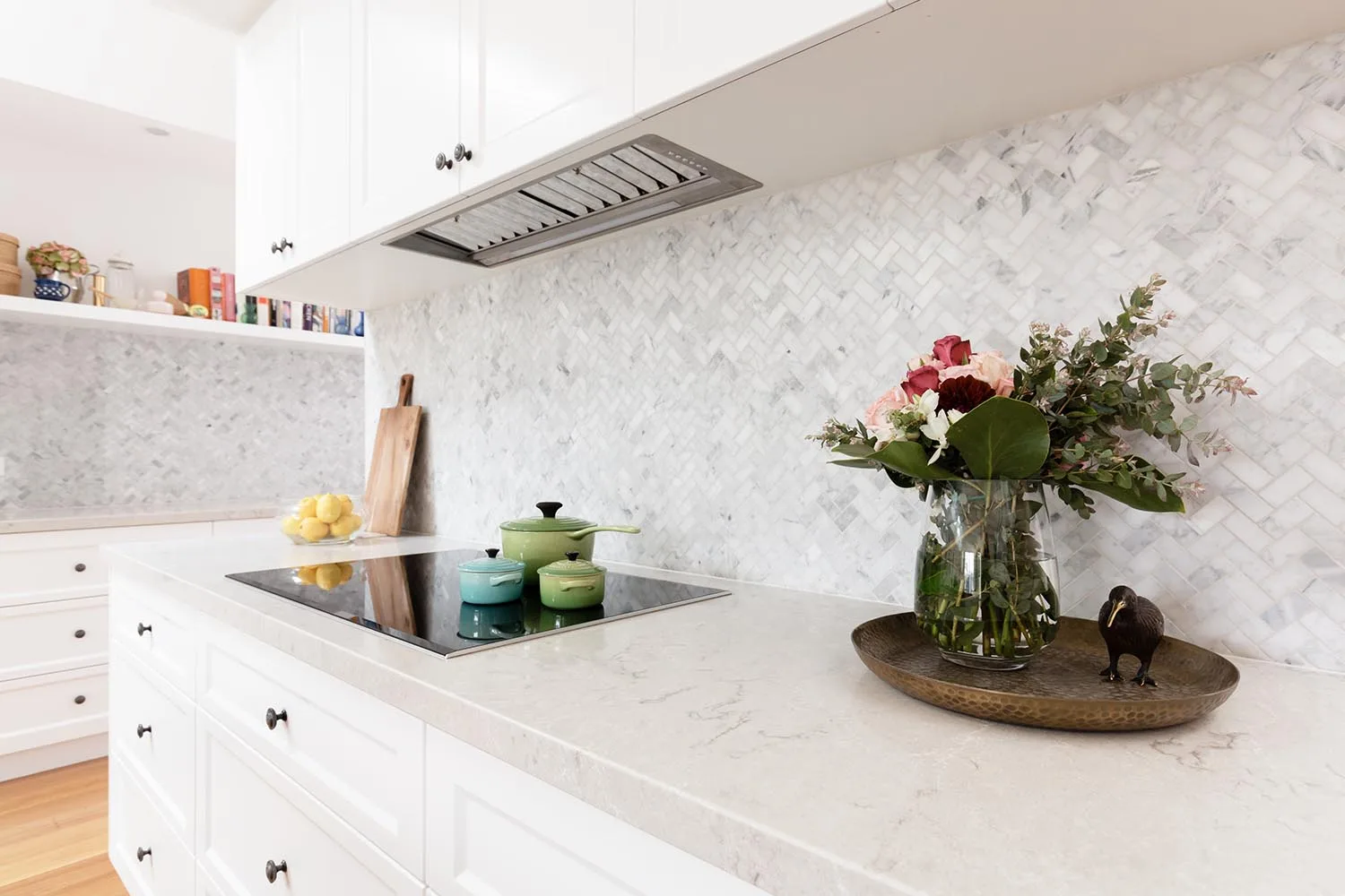kitchen benchtop with flowers and pots