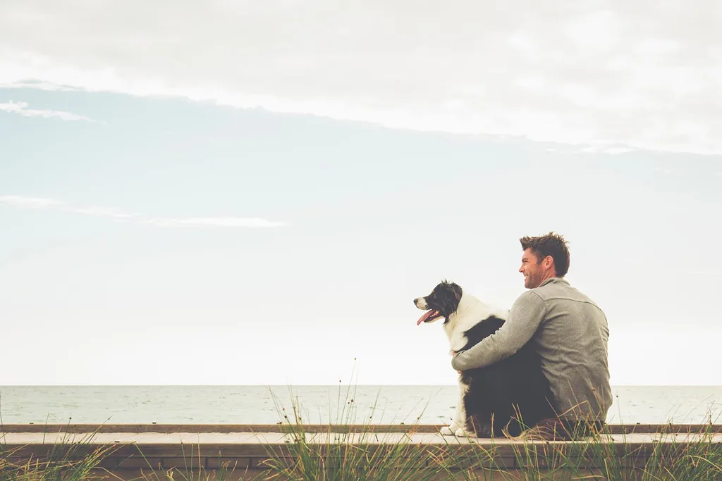 dog sitting with man