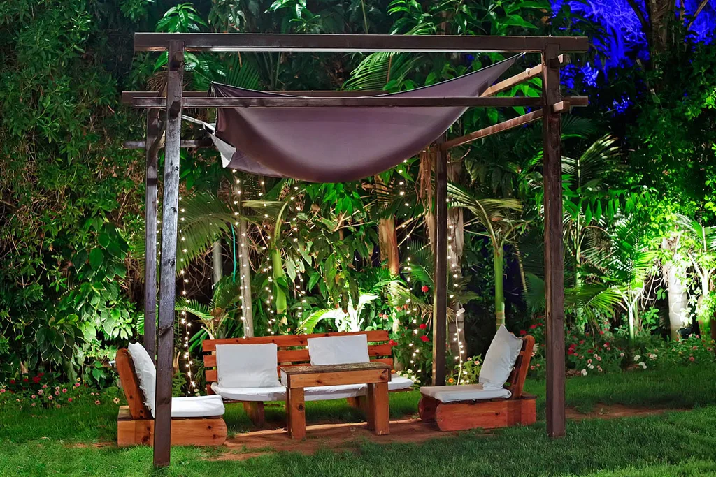 pergola made from dark timber with shade cloth roof