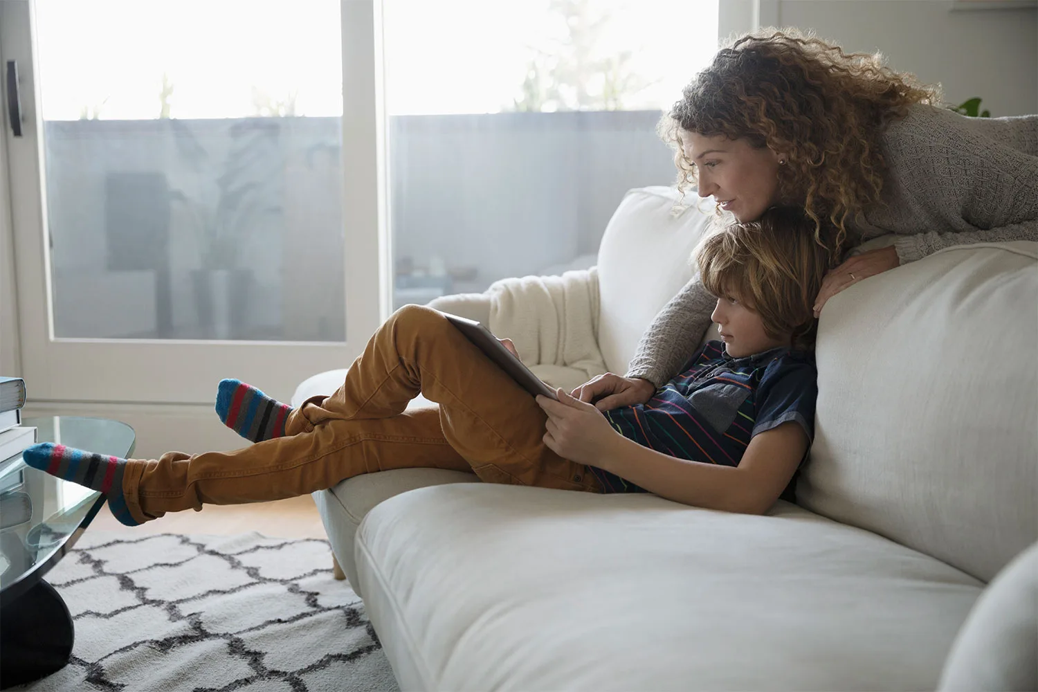 Mother and son using device together