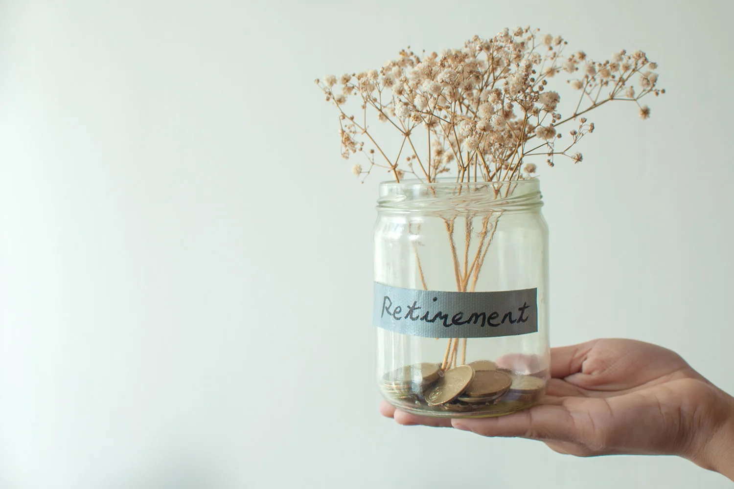 jar labelled retirement with brand in it