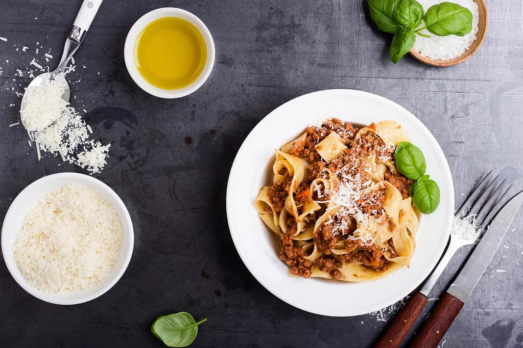 bowl of pasta and parmesan cheese