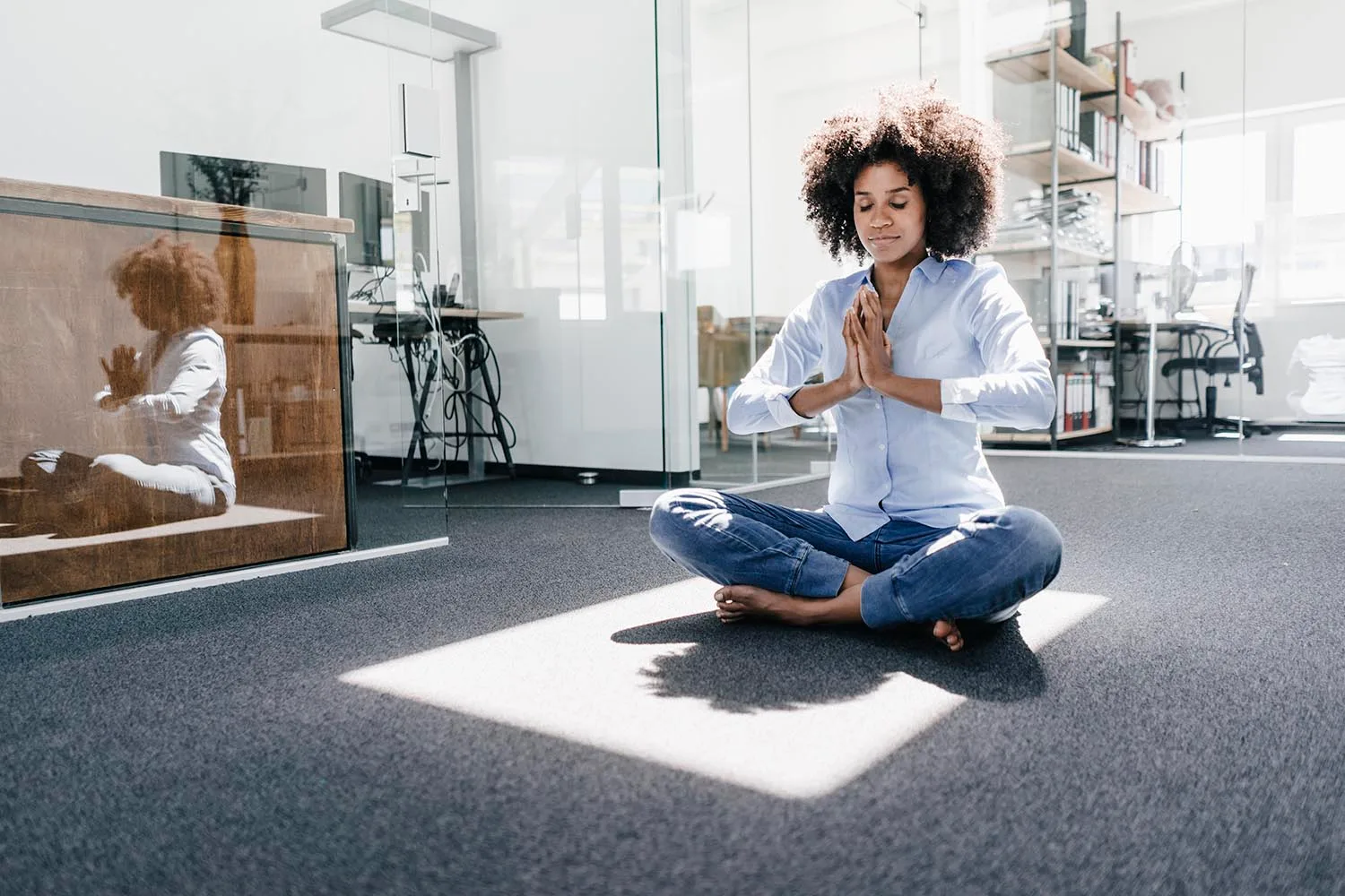 woman meditating in office