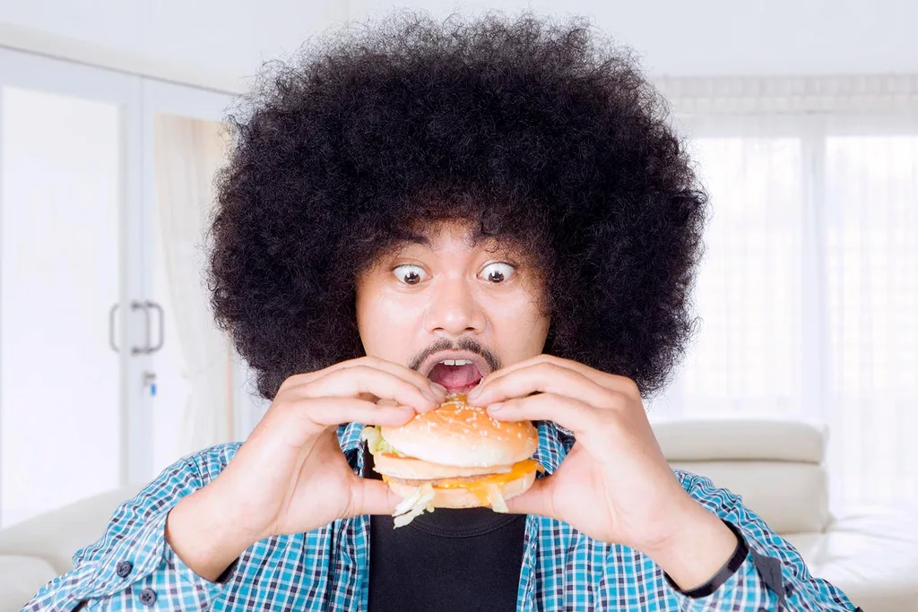 man eating a burger
