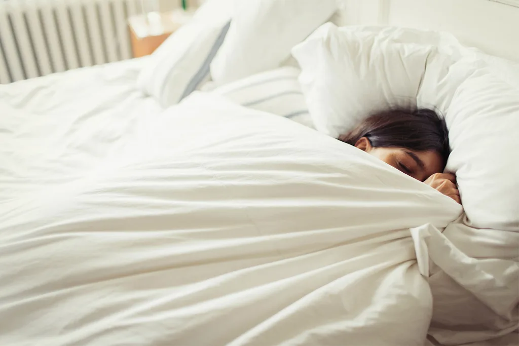 Woman sleeping in bed