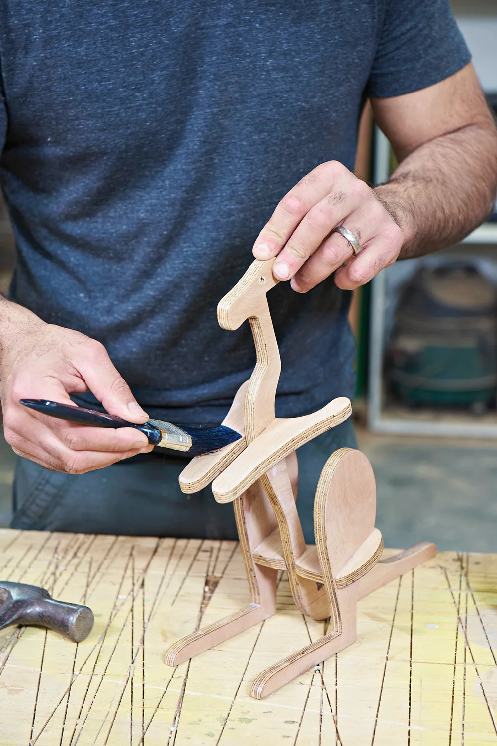 Applying varnish to plywood kangaroo