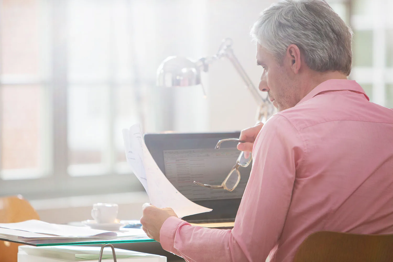 man looking at documents